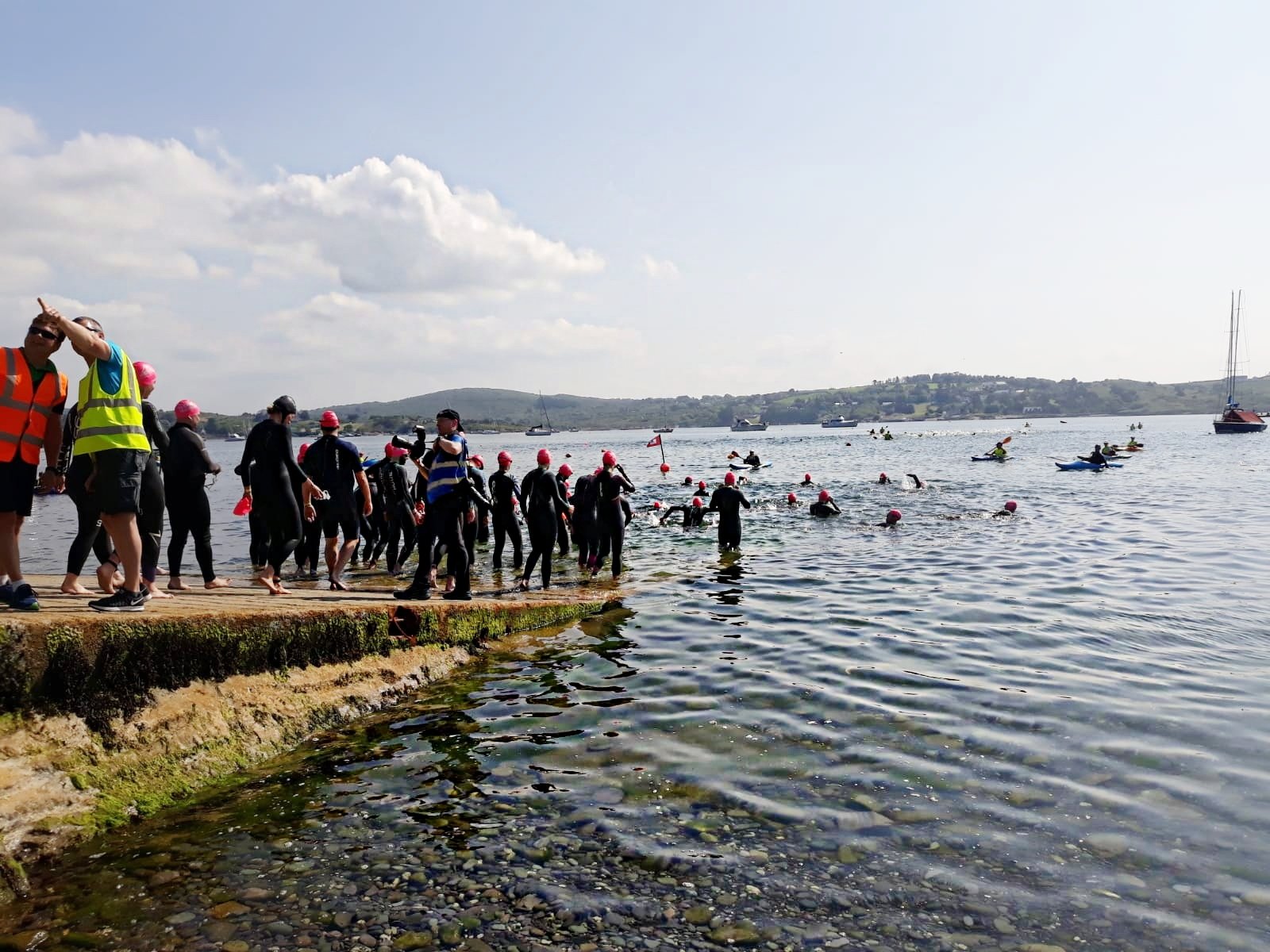 triathletes enter the water at schull triathlon