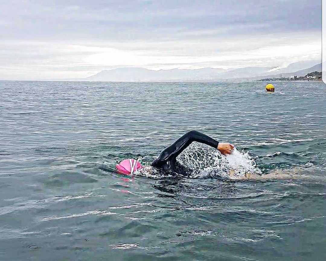 Triathlete open water swimming in the sea